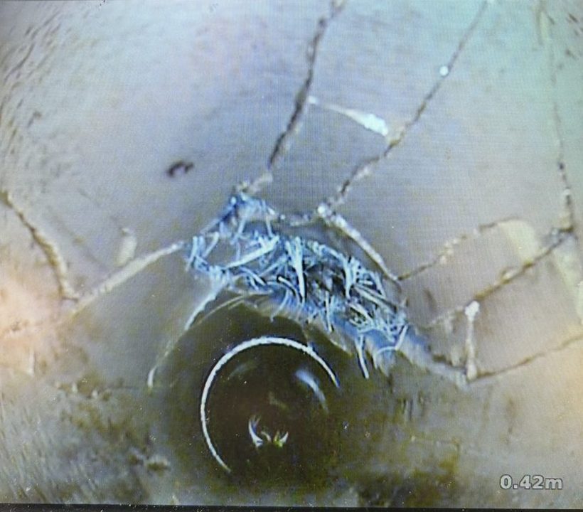 CCTV image of cracked drain pipe with root ingress before no-dig repair